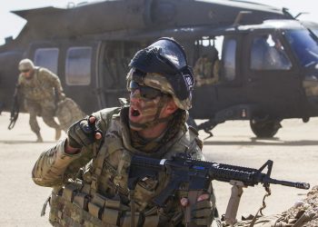 Sergeant 1st Class Aaron Sanford, a maintenance supervisor, Delta Battery, 1st Battalion, 145th Field Artillery Regiment, gives commands to his platoon following their departure from a UH-60 Black Hawk near Camp Buehring, Kuwait, Feb. 28, 2018. (U.S. Army photo by Spc. Joshua P. Morris, USARCENT PAO)