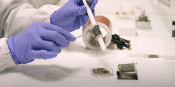 NTU researcher during testing of new magnetically activated glue.