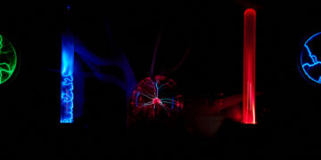 Electric plasma balls on dark background. Static electricity model