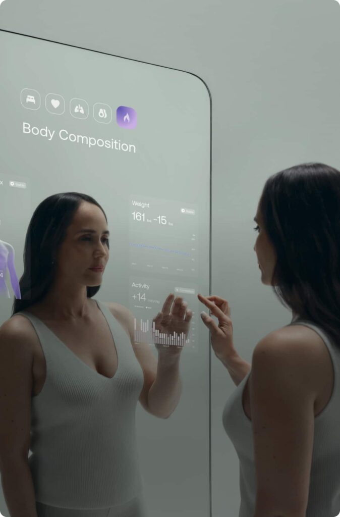 Omnia by Withings: a woman uses the new health technology on the touch screen